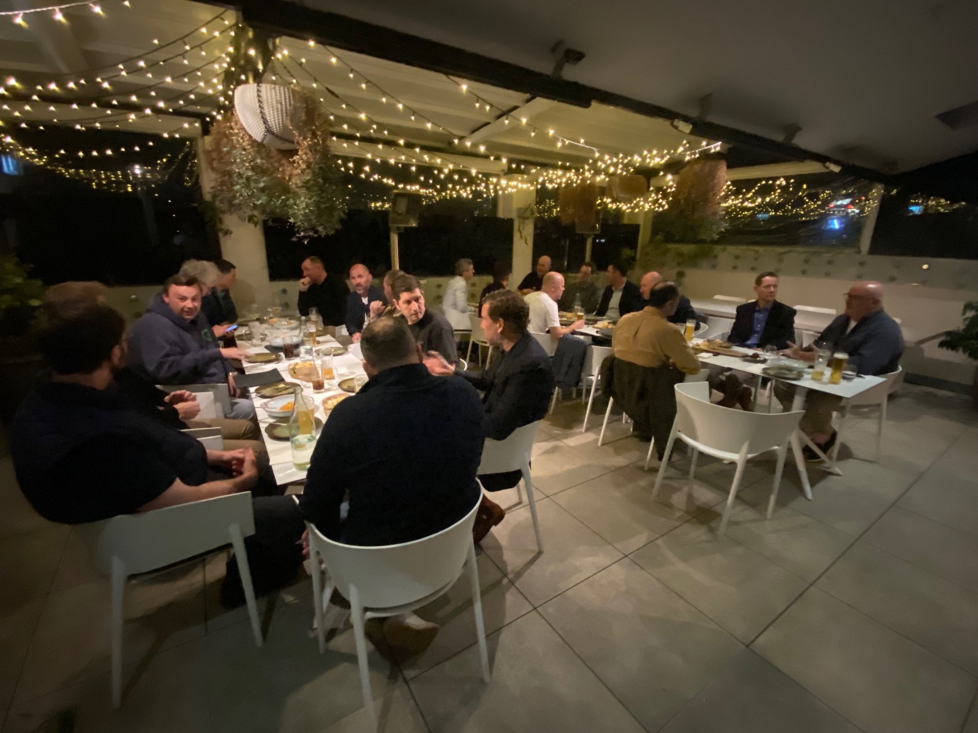 Guests seated at a long table during a previous Long Table dinner